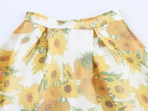 Detail view of sunflower oil painting print on pleated organza skirt with waist pleats