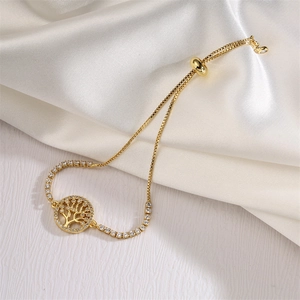 Detailed shot of golden Tree of Life bracelet with cubic zirconia and adjustable chain