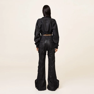 Rear view of black waxed workwear cargo pants and matching cropped jacket set