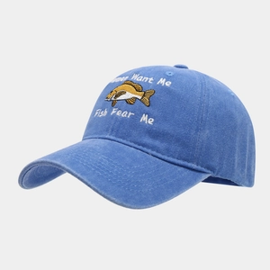 Close-up of Women Want Me Fish Fear Me embroidery on a light blue washed baseball cap