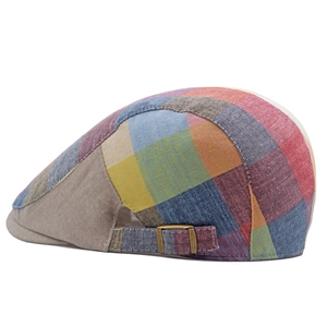 Side view of checkered flat cap with vintage bronze buckle and colorful cotton texture
