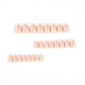 Classic French nude pink press-on nails with white tips in medium coffin shape set