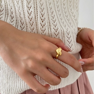 Minimalist gold textured heart ring for women with unique organic melting shape design