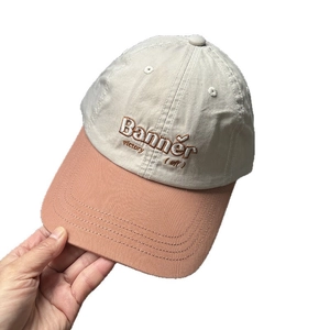 Retro two-tone baseball cap with Banner letter embroidery in cream and dusty pink colors