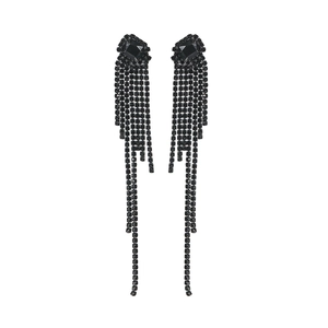 Detailed view of long black tassel earrings featuring sparkling crystal chain cascades