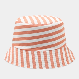 Detailed view of orange and white striped cotton fabric on a sun protection bucket hat