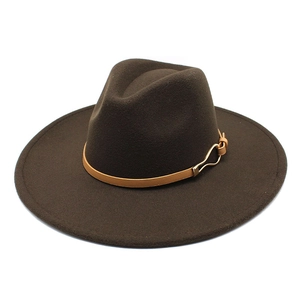 Detail of dark brown wool fedora hat featuring a light brown leather band and gold buckle