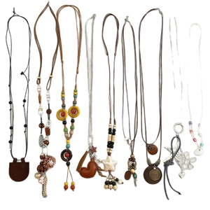 Bohemian style long sweater necklaces with leather cords and mixed metal pendants