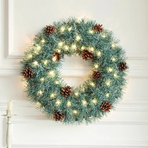 45cm Christmas wreath with pine cones and LED lights on a white decorative wall