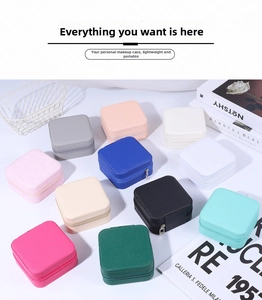 Multi-colored portable square jewelry boxes with zipper closure in a organized matrix