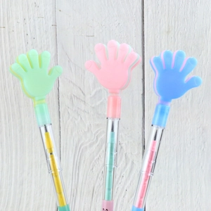 Detailed view of three colorful non-sharpening pencils with high-five hand shaped tops
