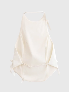 Detail of white halter neck top with satin finish and backless ribbon tie design