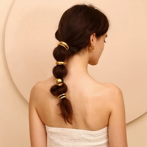 Minimalist 18K gold-plated crescent moon metal hair ties shown on a braided hairstyle