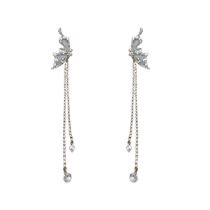 Boucles d'oreilles nœud argenté, émail bleu, strass et longues perles à pompons