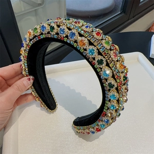 Close-up of sparkling colorful rhinestones on a padded velvet baroque headband