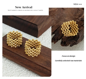 Detail of 18K gold plated mesh weave ring with micro-set Czech diamonds in a luxury style