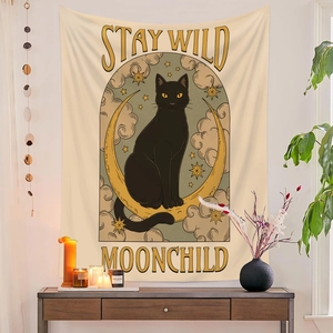 Detail of Stay Wild Moonchild tapestry featuring a black cat sitting on a yellow crescent moon