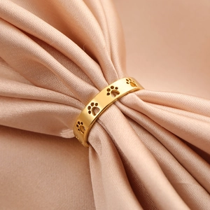 Minimalist 18K gold hollow cat paw print stainless steel wide band ring on silk