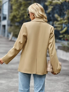 Back view of khaki blazer featuring professional center back vent and mid-length cut