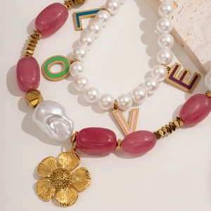 Colorful baroque beaded necklace set with a large gold flower pendant and LOVE charms