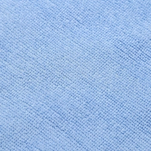 Macro detail of blue microfiber pet towel fabric showing soft absorbent loop structure