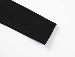 Detailed macro view of the black elastic sleeve cuffs showing knit fabric texture and stitching