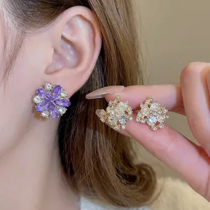 Elegant floral stud earrings with purple rhinestones and gold crystal accents for women