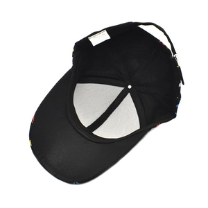 Detail view of the black cotton baseball cap interior with adjustable buckle and colorful brim