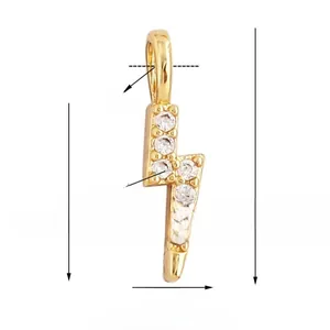 Macro view of gold lightning bolt pendant with white cubic zirconia and dimensions