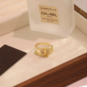 Detail of golden elephant ring with zircon ears and red gemstone eyes on a display tray