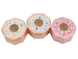 Pink octagonal gift boxes with a donut pattern and a clear window on top for sweets