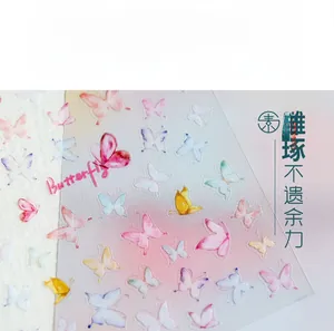 Macro detail of 5D thin butterfly nail stickers with translucent colorful patterns