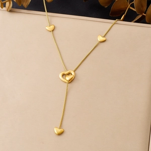 Y-shaped gold-plated stainless steel necklace with matte heart charms and tassel chain