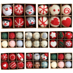 Christmas wool felt ornaments set with various festive patterns in a kraft gift box