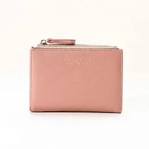 Pink minimalist short faux leather wallet with gold Forever Lucky text and zip closure
