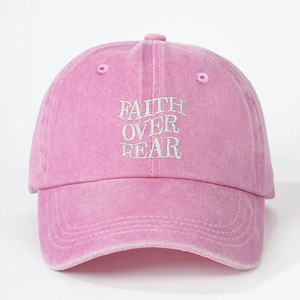 Pink washed cotton baseball cap featuring white Faith Over Fear embroidery in retro style