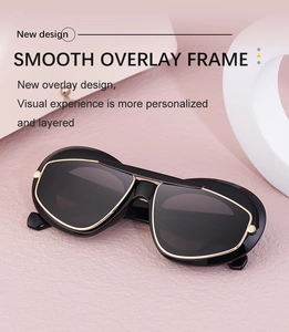 Detail of smooth overlay frame design with golden trim on black cat-eye sunglasses