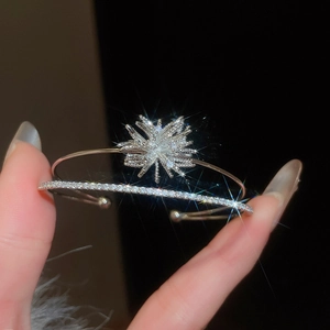 Close-up of silver zircon firework bracelet with shimmering double-layer open design