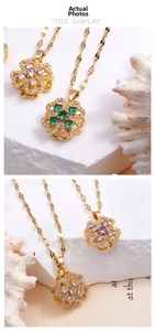 Detailed macro view of gold clover pendant with rotating colorful zircon flower petals
