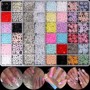 Detailed nail art kit featuring mixed alloy shapes and colorful studs in a divided case