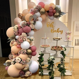 Pink and peach balloon arch kit with floral accents for baby shower party decoration