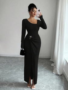 Detail of knitted dress with silver ring buckle, ruching effect and side slit feature