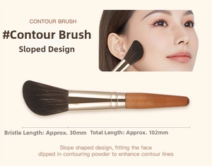 Macro detail of a 102mm angled contour brush with 30mm soft brown bristles and wood handle