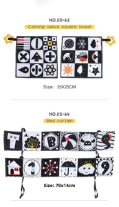 Detail of black and white baby cloth book and soft comforter with star teether toy
