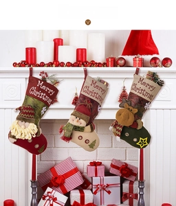 Detailed view of 3D Santa, Snowman, and Reindeer plush Christmas stockings with hanging loops