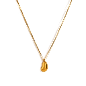 Minimalist gold bean pendant necklace with delicate chain on a clean white background