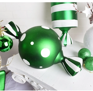 Detail of a 40cm green candy ornament with white polka dots for Christmas decor