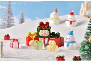 Christmas miniature resin set featuring cute snowmen and pigs in festive snow landscape