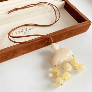 Sweet cloud and star pendant necklace with cream resin beads and brown velvet cord