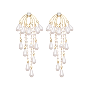 Golden chandelier drop earrings with white pearls and sparkling zircon on white background